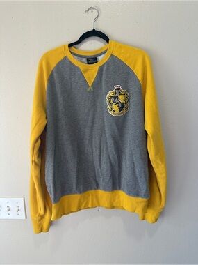 Universal Gray Crewneck Sweater with Yellow Raglan Sleeves and Crest